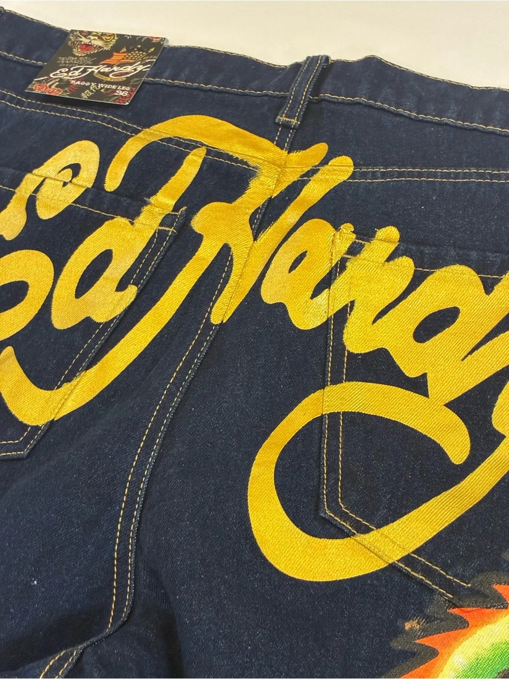 Ed Hardy Dark Blue Jeans with Yellow Script and Neon Skull Artwork